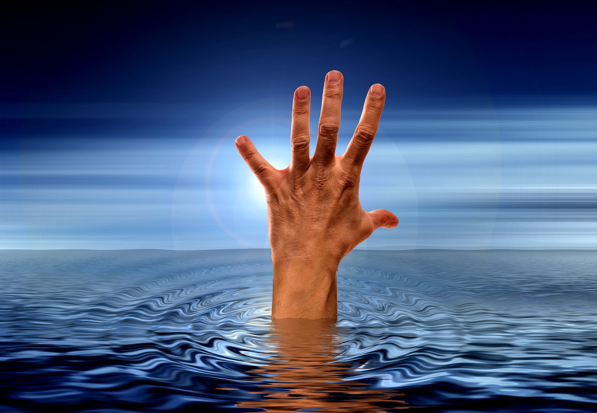 Hand reaching out of water symbolizing urgency for legal aid in child custody matters in Anne Arundel County